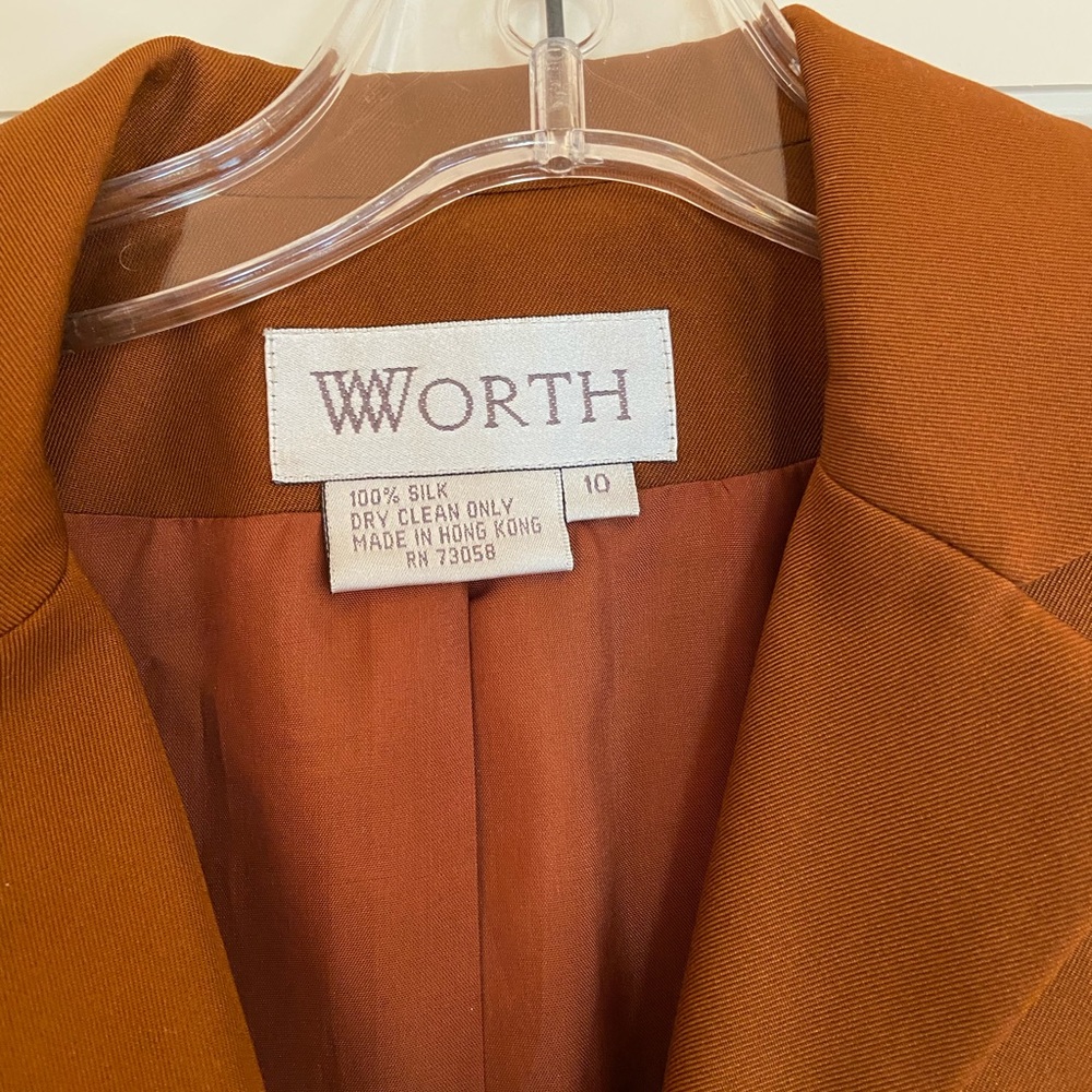Rick brown jacket with zipper front looks great with white jeans